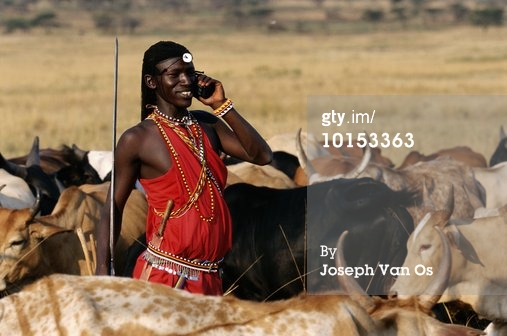 MAASAI MORAN WARRIOR ON CELL PHONE, KENYA